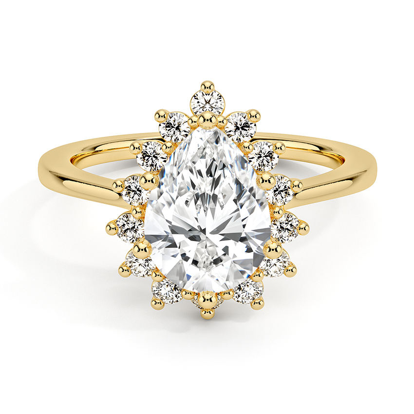 Anillo Celeste en tono oro amarillo con diamante pera y halo escultórico